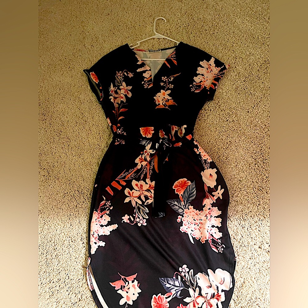 Simple yet elegant floral dress with tie at waist.